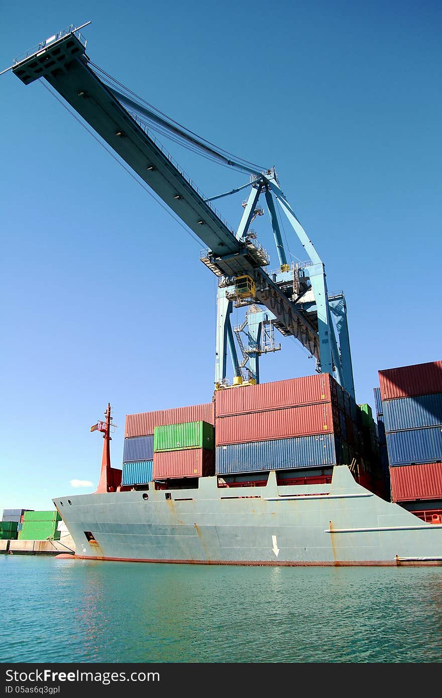 Crane and container ship working in the port of Alicante; Spain.