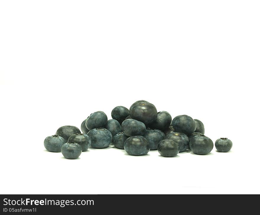 Pile of ripe blue berries on white background