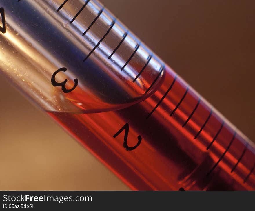 Pen-syringe with red liquid inside closeup