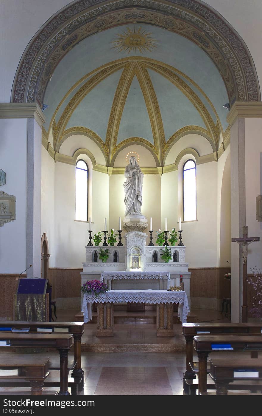 Interior of a church with a statue of the Virgin Mary. Interior of a church with a statue of the Virgin Mary