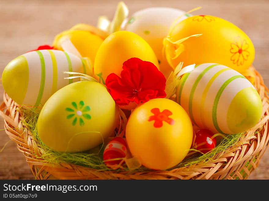 Colorful easter eggs in a wicker basket