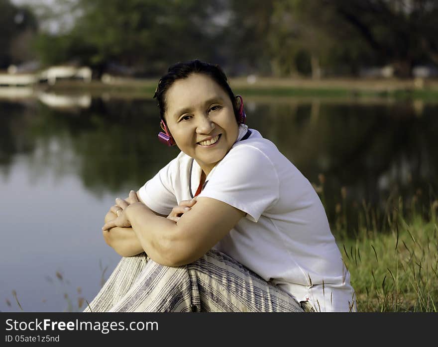 Happy Woman Listening To Music Outdoors