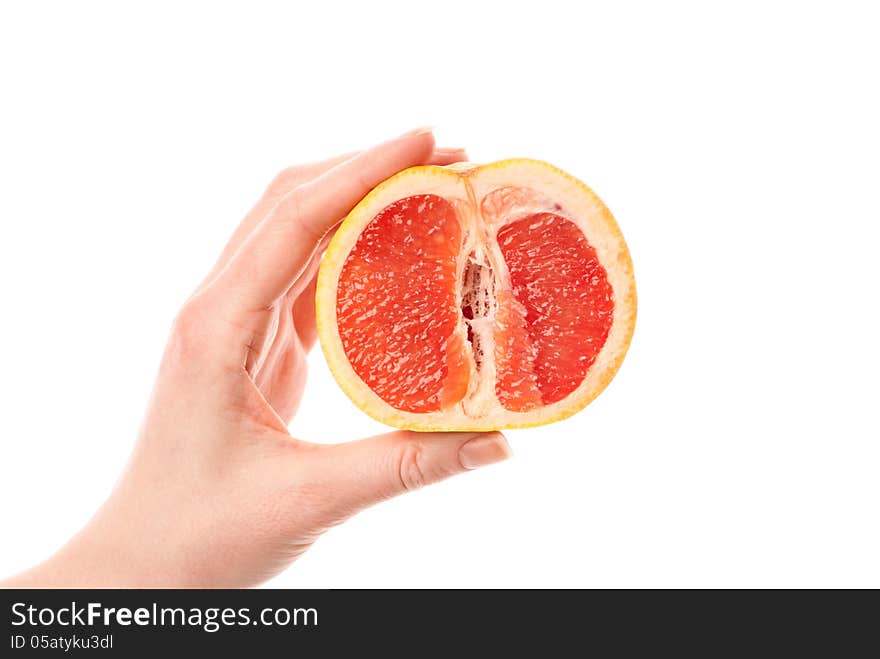 Female hand holdin grapefruit. White background. Studio shot. Female hand holdin grapefruit. White background. Studio shot