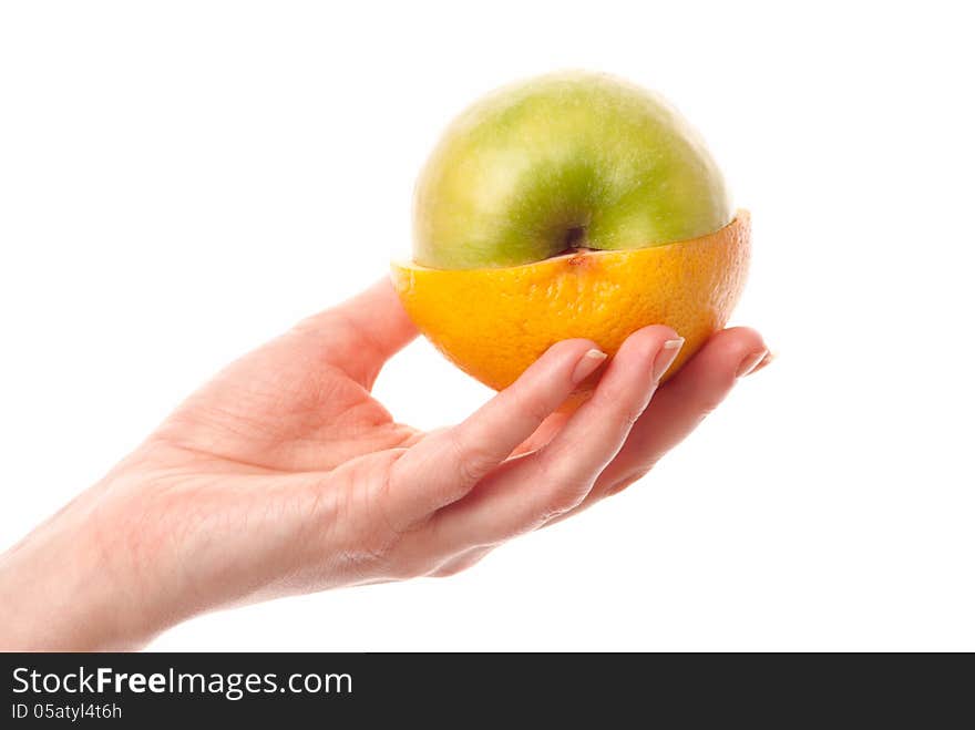 Female hand holdin half of an apple and half of a grapefruit. White background. Studio shot. Female hand holdin half of an apple and half of a grapefruit. White background. Studio shot