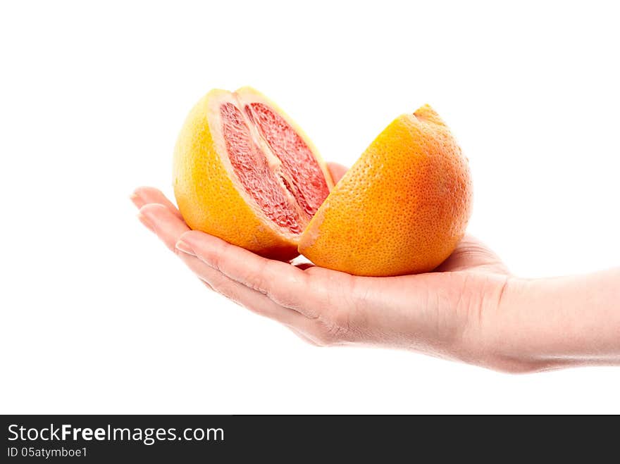 Female hand holdin grapefruit. White background. Studio shot. Female hand holdin grapefruit. White background. Studio shot