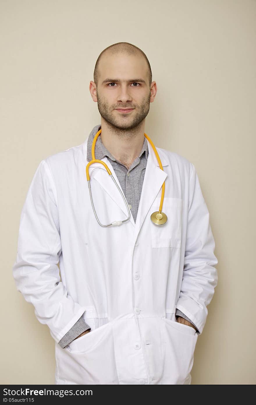 Portrait of a doctor of stethoscope isolated on light background