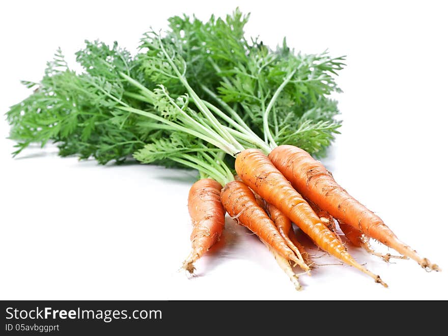 Carrots with leaves on a white background.