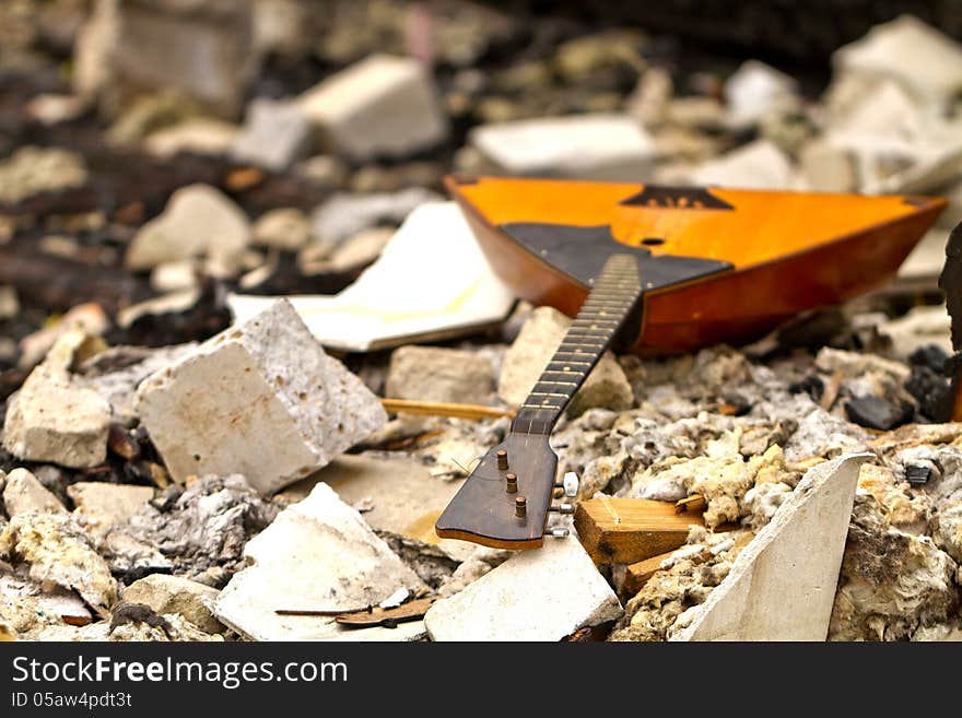 Balalaika on the ruins of a destroyed old building. Balalaika on the ruins of a destroyed old building