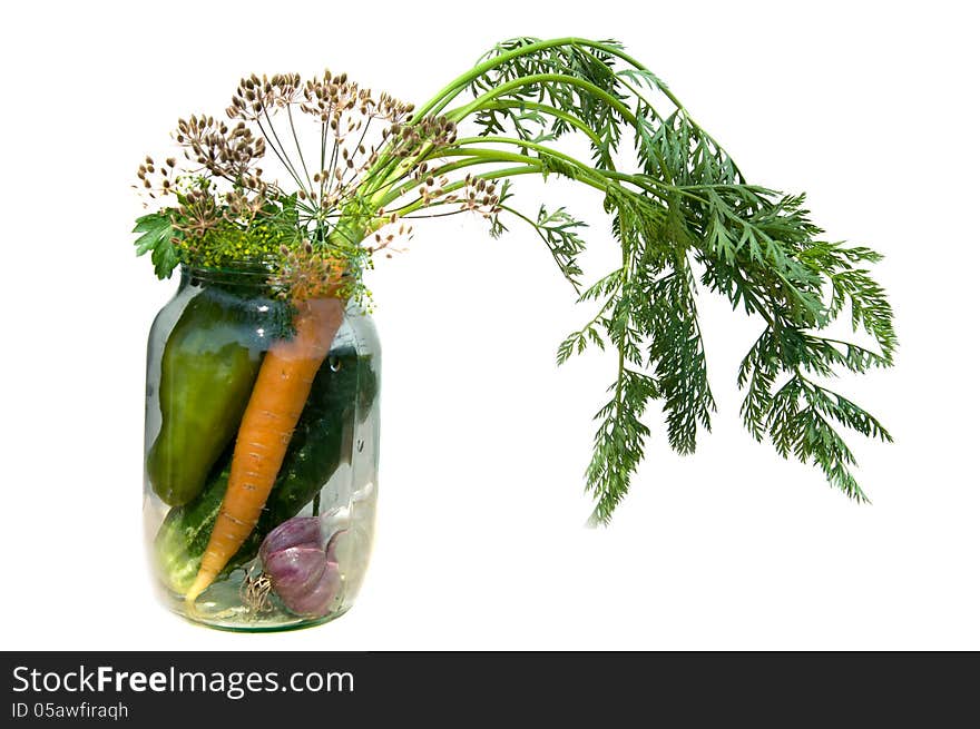 Pepper, carrot, cucumber, dill and garlic in a glass jar. Pepper, carrot, cucumber, dill and garlic in a glass jar.