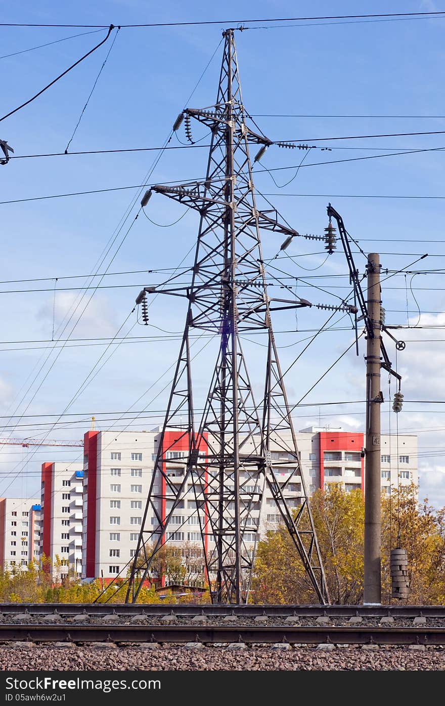 Power line, railway and houses against the sky. Power line, railway and houses against the sky.