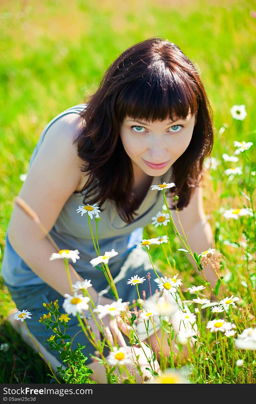 Woman Smelling Camomiles