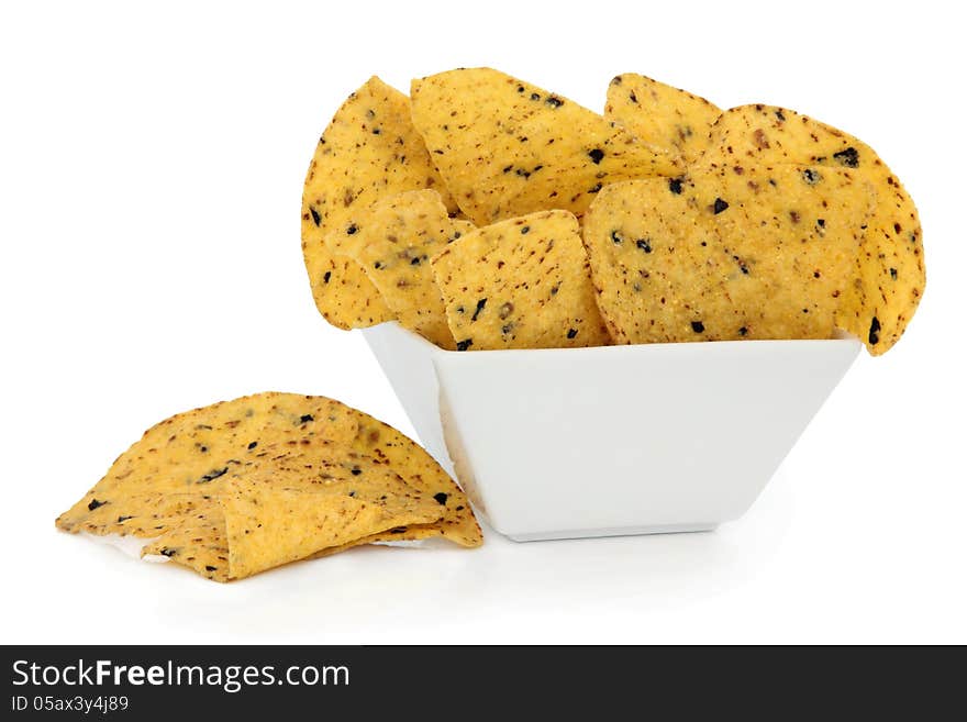 Tortilla chips in a porcelain bowl over white background.