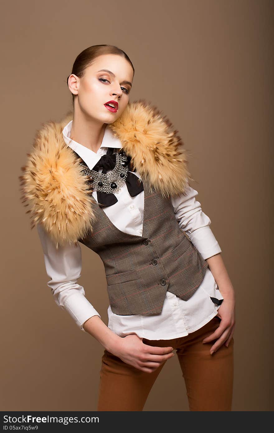 Fashion Woman in Grey Waistcoat and Fur Collar. Fashion Woman in Grey Waistcoat and Fur Collar