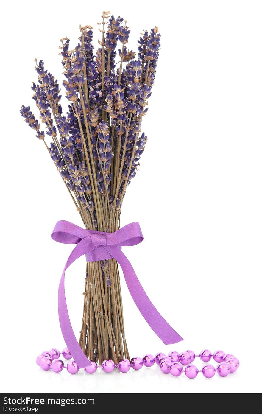 Lavender herb flower posy with lilac bead strand over white background. Lavender herb flower posy with lilac bead strand over white background.