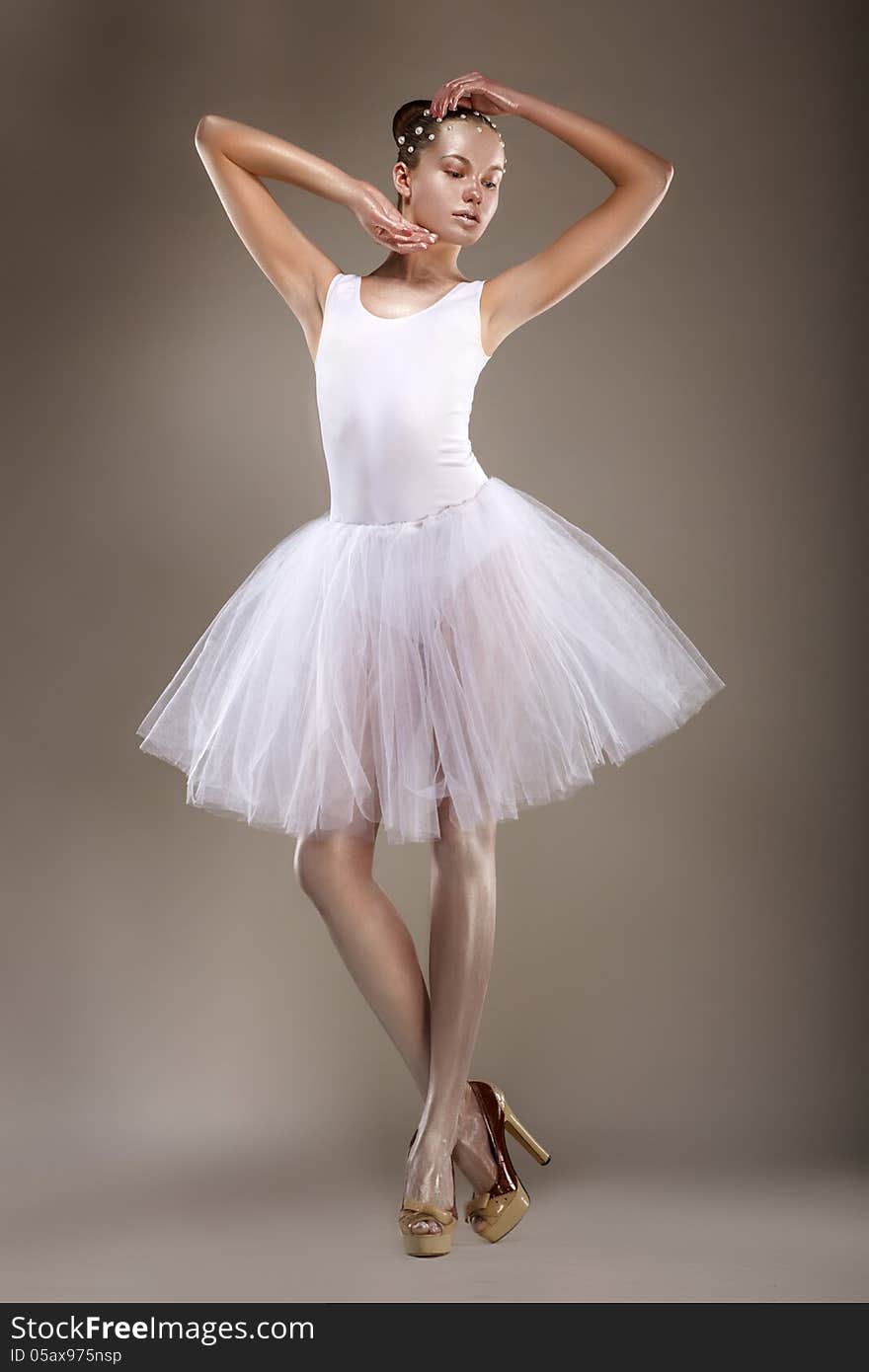 Ballet. Graceful Ballerina in White Light Tutu - Performance. Fantasy