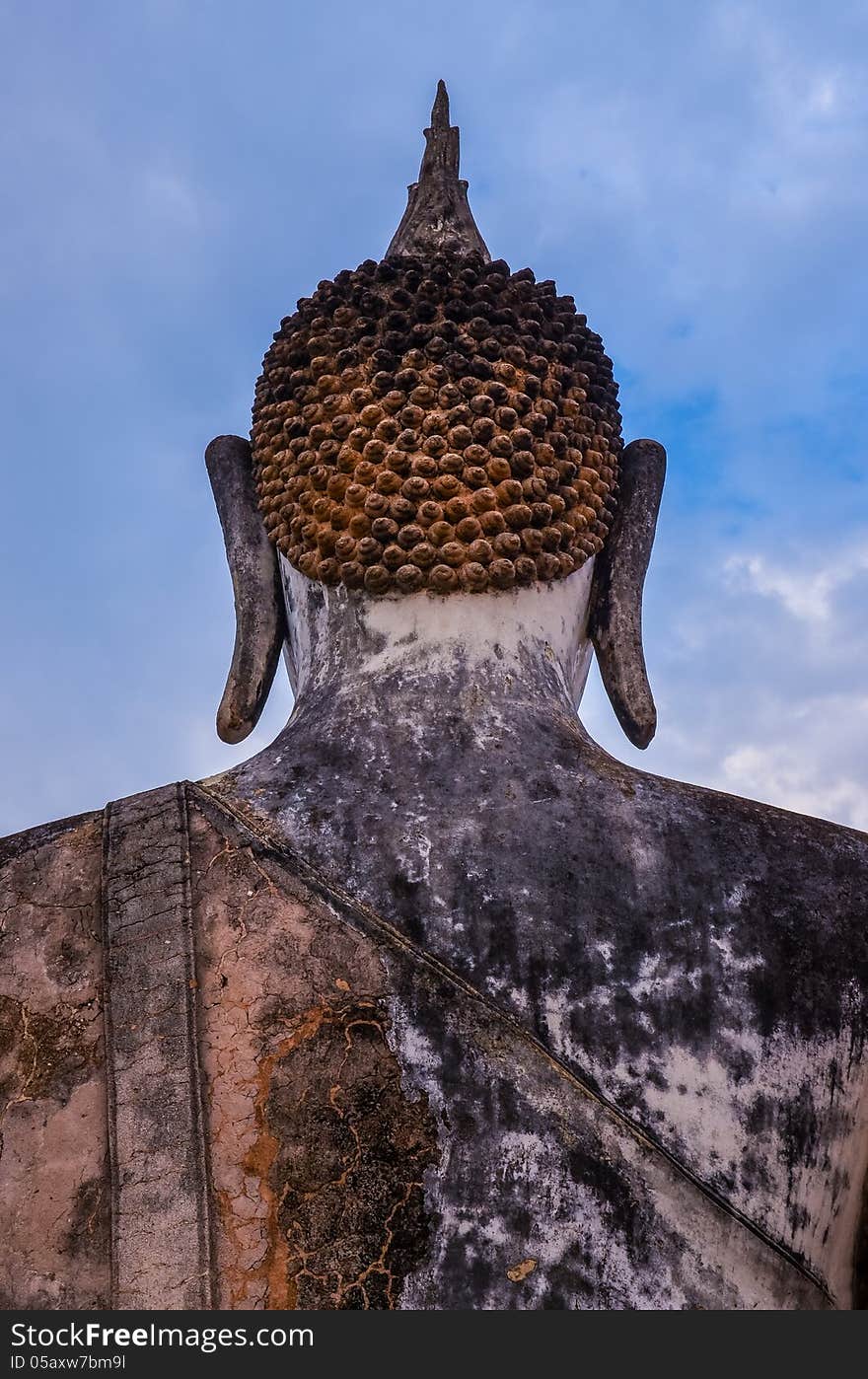 Detail of head of stone statue of sitting Buddha in Sukhothai hi