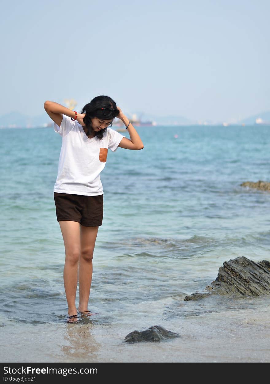 Beautiful young asian woman on beach summer holiday