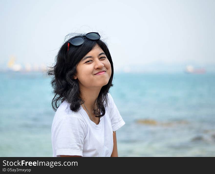 Young beautiful girl on the seaside