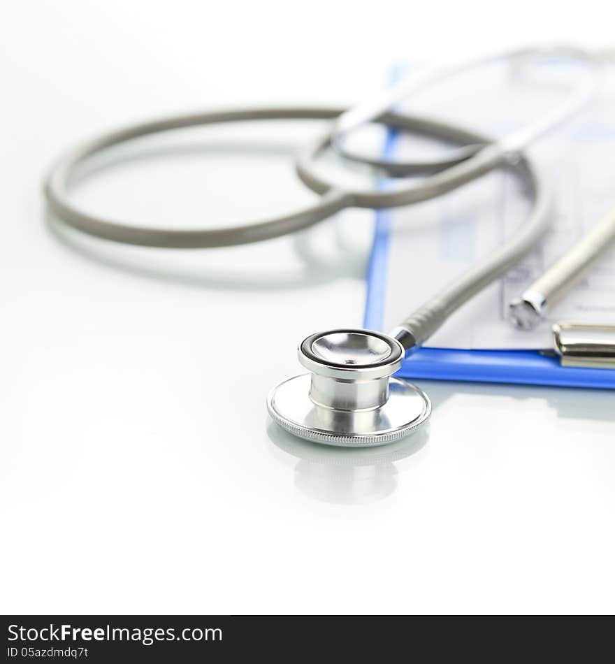 Stethoscope with blue medical clipboard