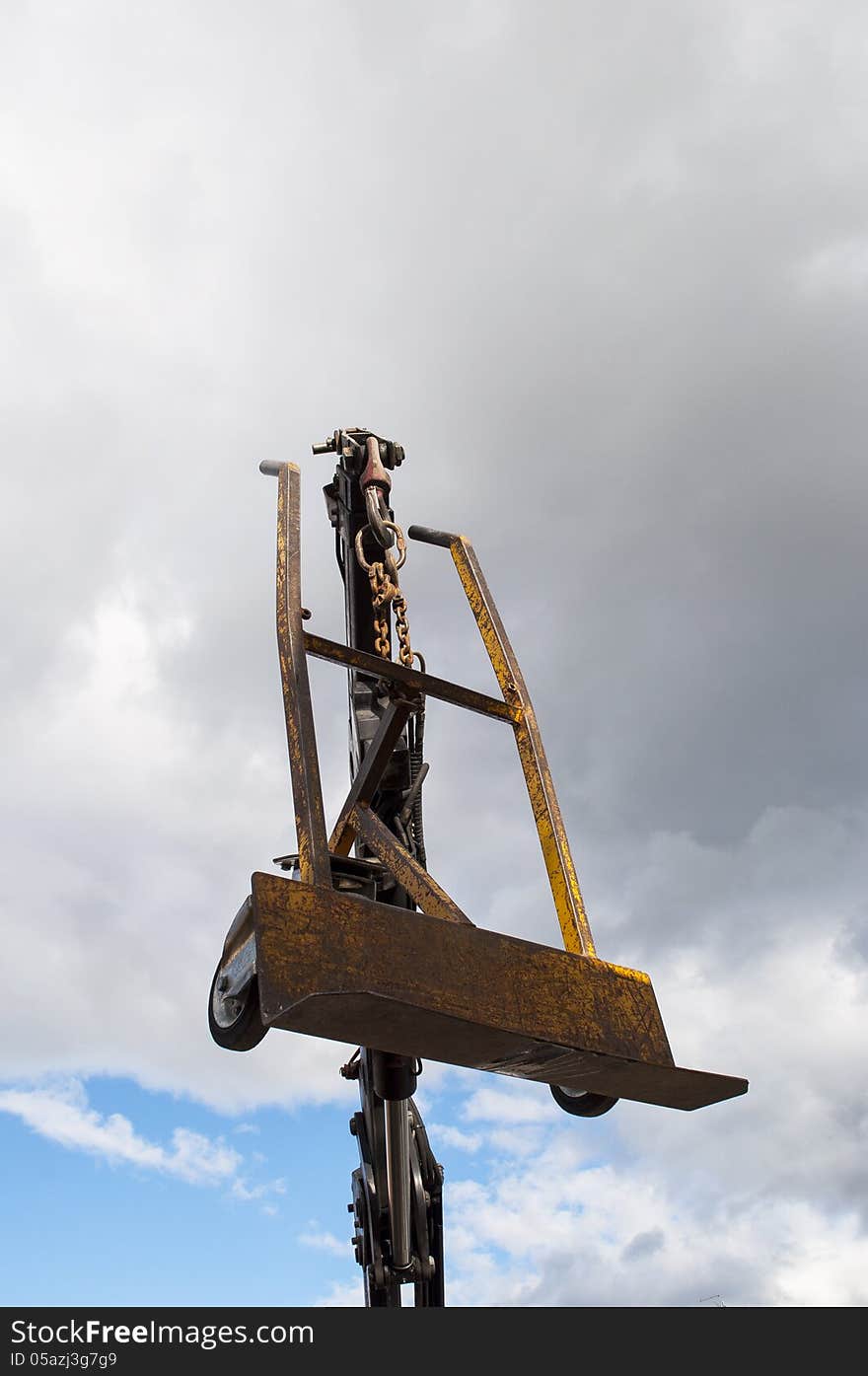 Hydraulic Cranes with hand truck in the blue sky