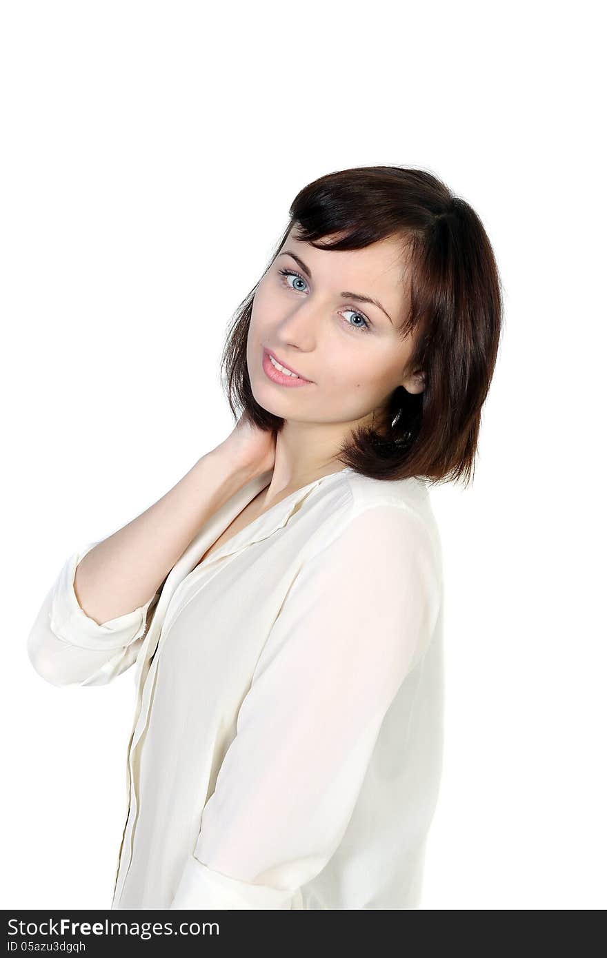 Portrait of a young brunette attractive woman in a white blouse. Isolated on white background. Portrait of a young brunette attractive woman in a white blouse. Isolated on white background