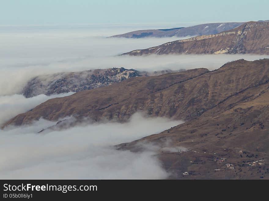 Winter mountains in the clouds