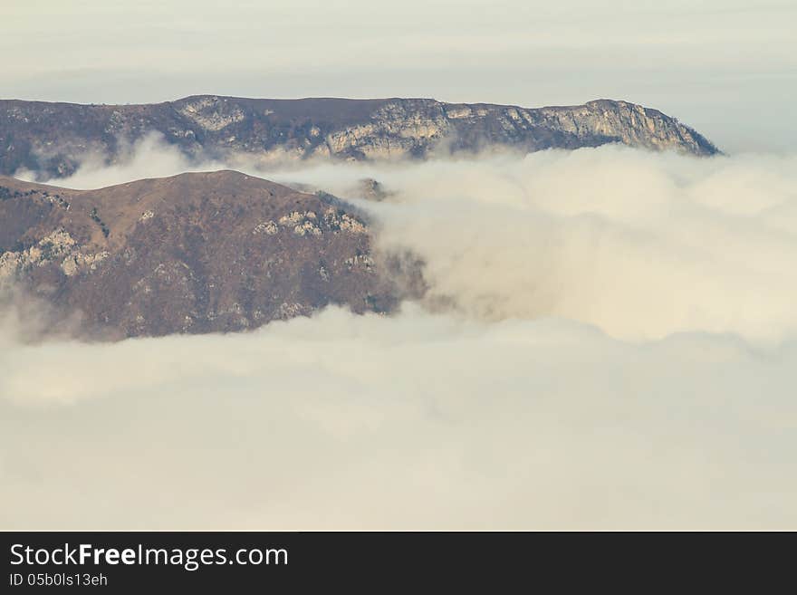 Winter mountains in the clouds