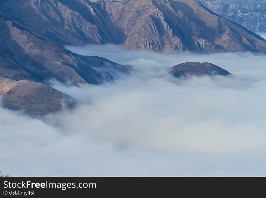 Winter mountains in the clouds