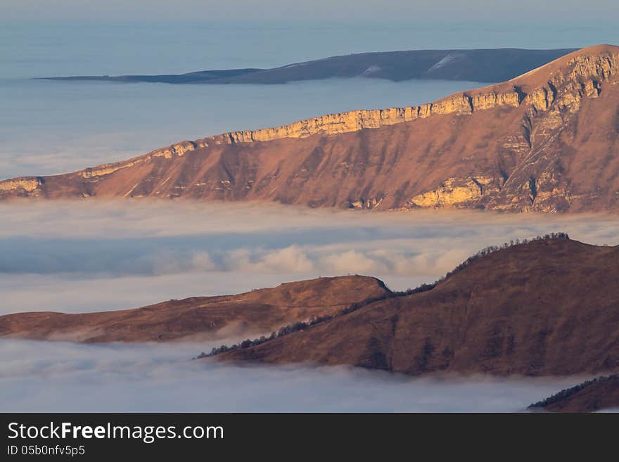 Winter mountains in the clouds