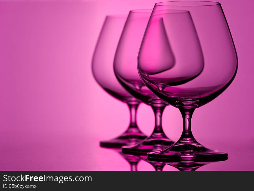 Set of empty brandy goblets. Studio shot. Set of empty brandy goblets. Studio shot