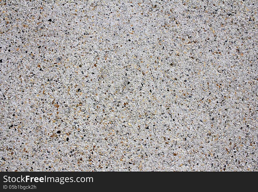 Background of a very beautiful tropical and exotic sidewalk made out of a variety crushed seashells, ocean pebbles, sand and concrete. Background of a very beautiful tropical and exotic sidewalk made out of a variety crushed seashells, ocean pebbles, sand and concrete.