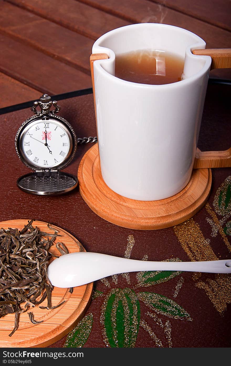 A cup with hot tea, at five o' clock. A cup with hot tea, at five o' clock