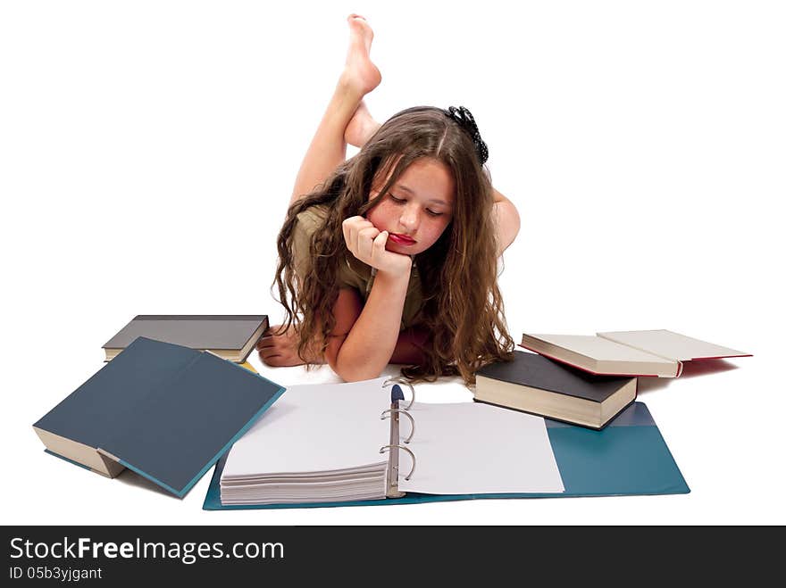 Horizontal shot of a girl reading or looking down at a notebook with other books scattered about. Isolated on a white background. Copy space on the blank pages. Horizontal shot of a girl reading or looking down at a notebook with other books scattered about. Isolated on a white background. Copy space on the blank pages.