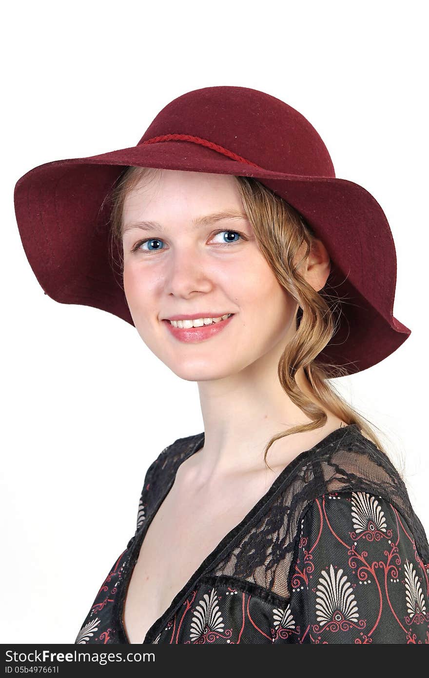 Portrait of a young blonde attractive girl in red hat isolated over white background. Portrait of a young blonde attractive girl in red hat isolated over white background