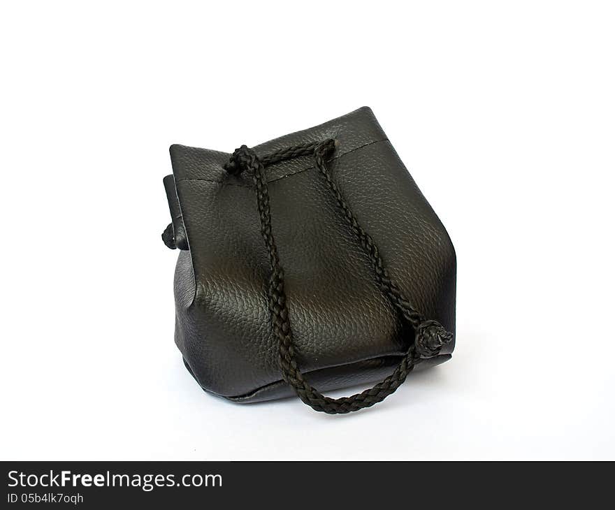 The black leather hand bag isolated on white background. The black leather hand bag isolated on white background