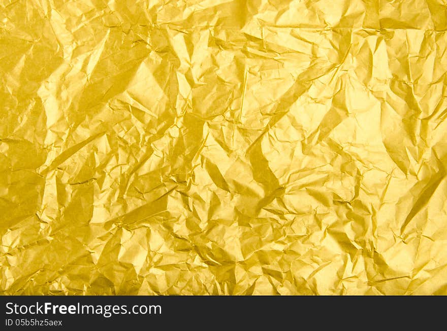 Texture and background of wrinkled golden paper