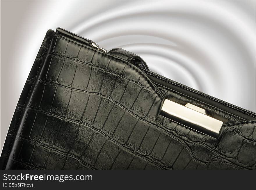 A Black Business Handbag Isolated On A Graduated Background