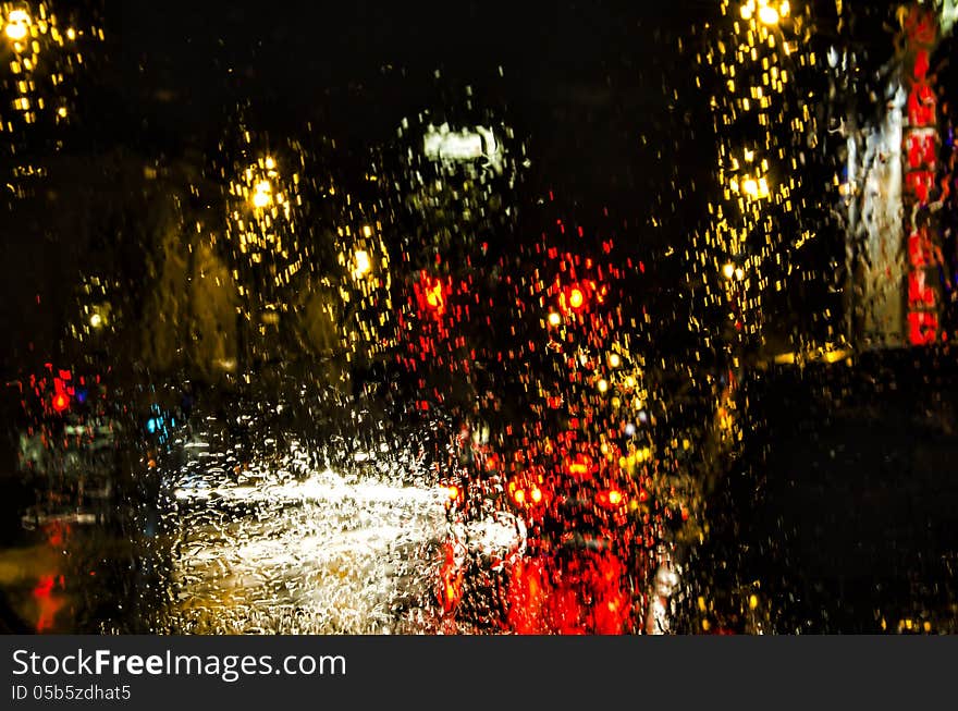 Rain and the lights at a Traffic Signal. Rain and the lights at a Traffic Signal.