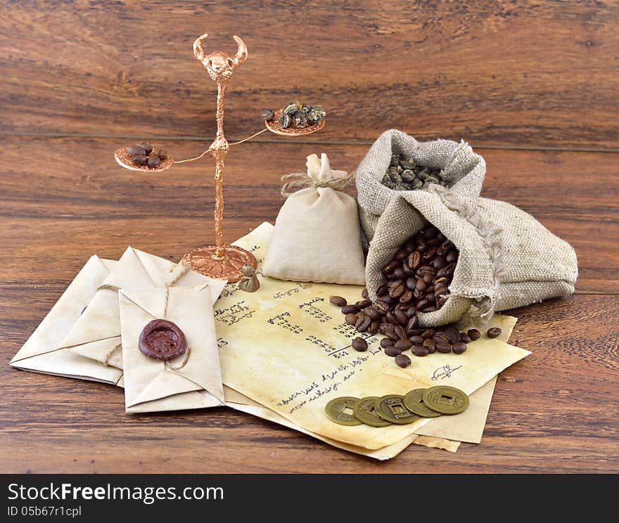 Scales with coffee and tea in burlap sacks. Scales with coffee and tea in burlap sacks