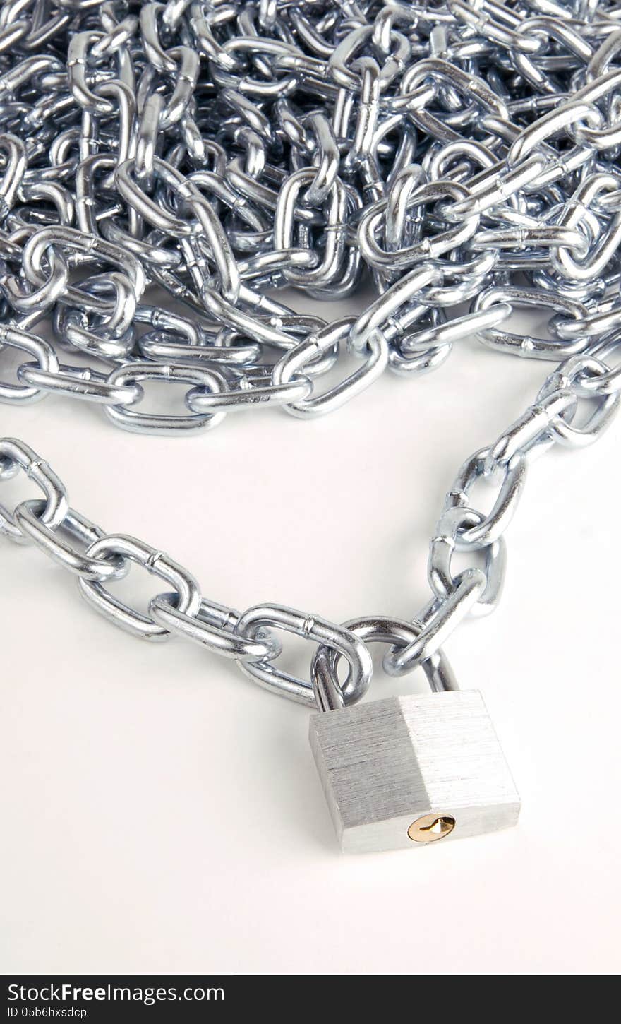 Link Chain Connected By Keyed Steel Locking Padlock on White