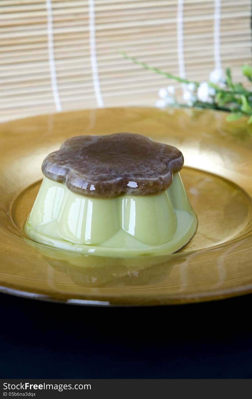 Green tea pudding on golden plate