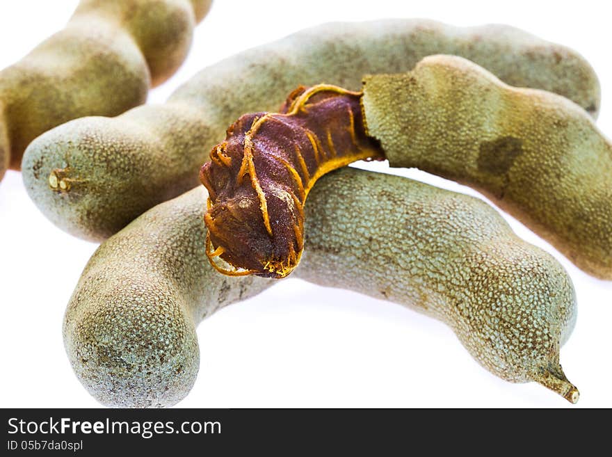 Ripe tamarind fruit on white background