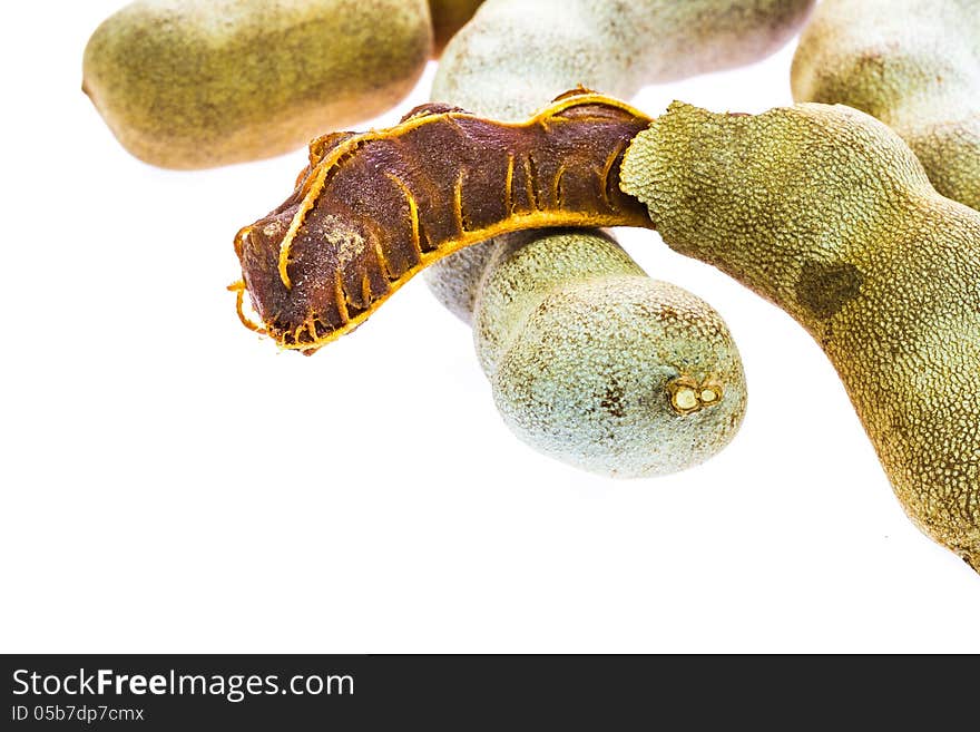 Ripe tamarind fruit on white background