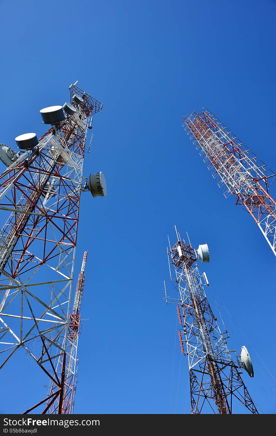 Telecommunication tower with a sunlight. Used to transmit television signals.