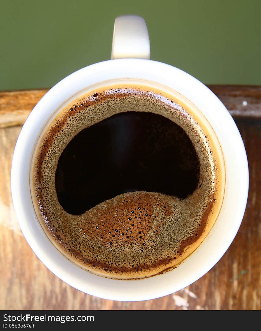 Close-up image of white cup of coffee