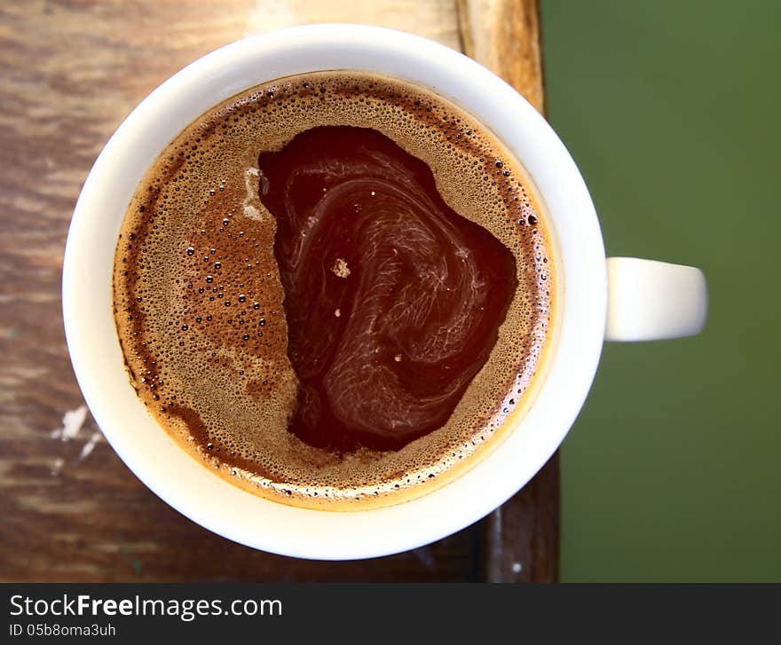 Close-up image of white cup of coffee