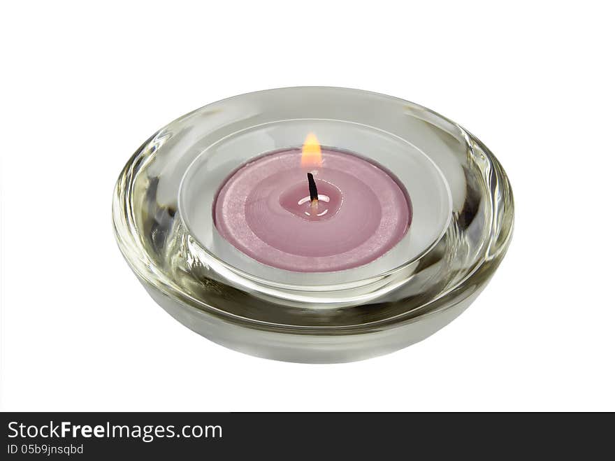 A candle in a glass holder.Isolated on white.