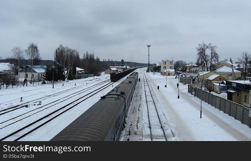 Image of panorama to railway station and rails in winter