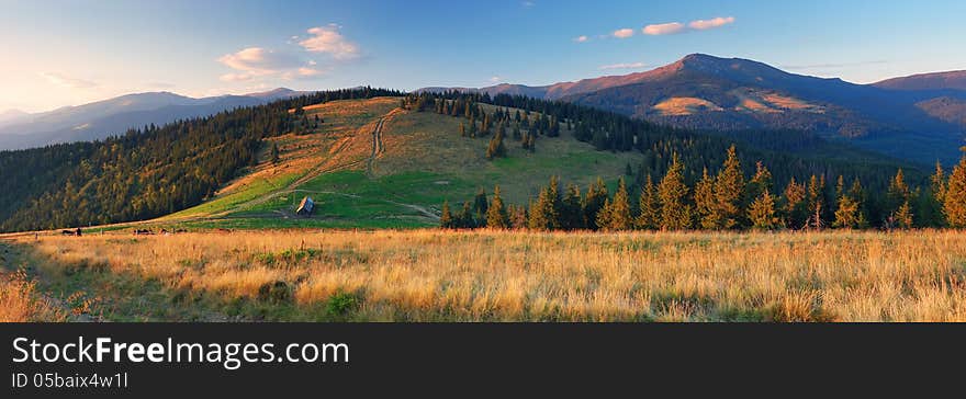 Farm in the mountains. Panorama night landscape. Farm in the mountains. Panorama night landscape