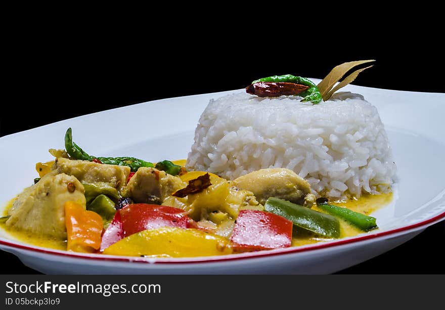 Yellow Thai chicken curry served with Jasmine rice. Yellow Thai chicken curry served with Jasmine rice.